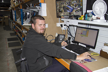 Jonathon at his work desk