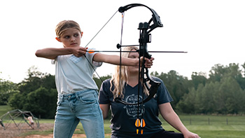 Youth shooting the Bear Archery Brave RTS